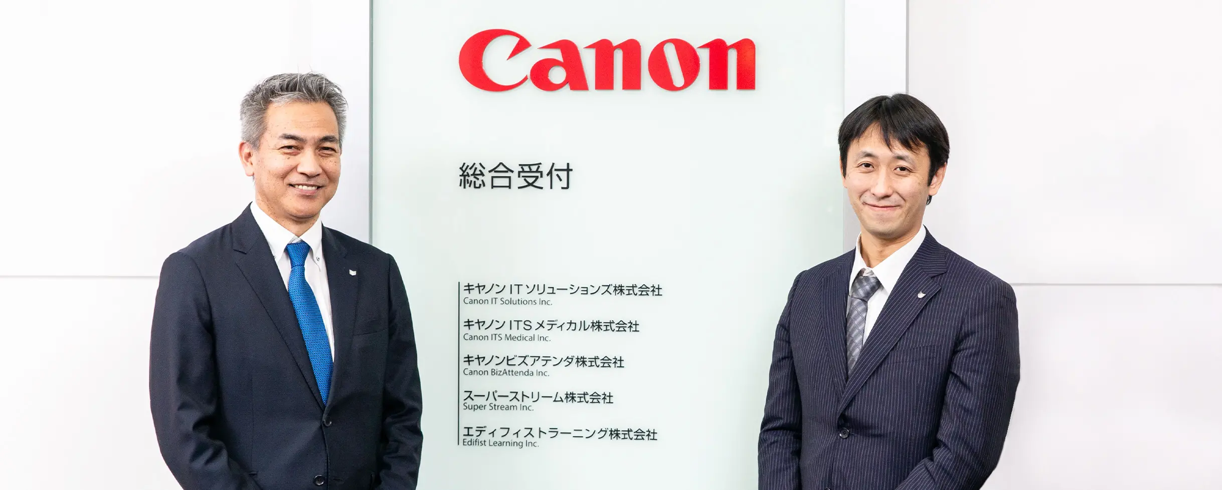 BPOプロジェクトマネージャー 島 吉和とヘルプデスクスペシャリスト 森末 圭一の写真